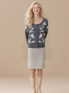 Women's embroidered cardigan sweater with front button placket and cable knit design.