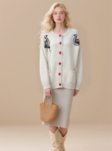 Women's embroidered cardigan sweater with button front, twisted knit jacket with pockets.