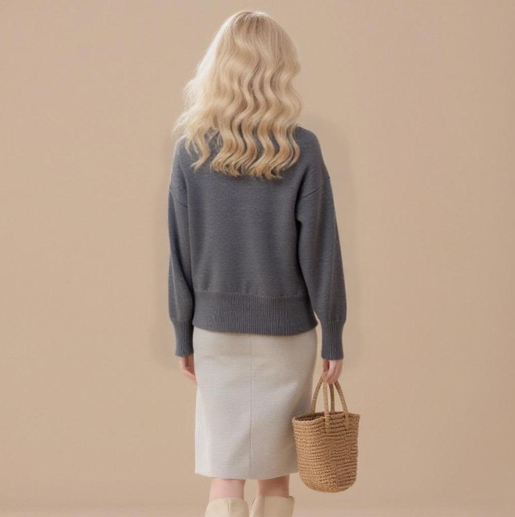 Women's embroidered cardigan sweater with front button placket and cable knit design.