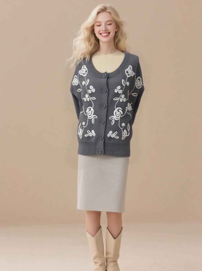 Women's embroidered cardigan sweater with front button placket and cable knit design.