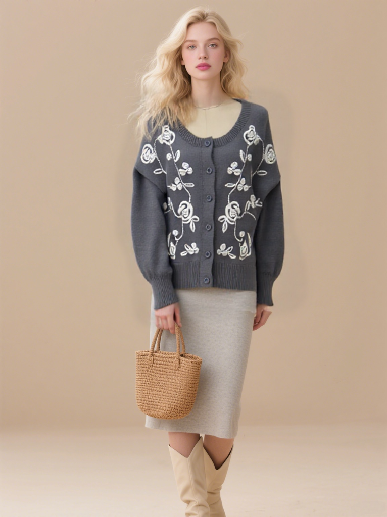 Women's embroidered cardigan sweater with front button placket and cable knit design.